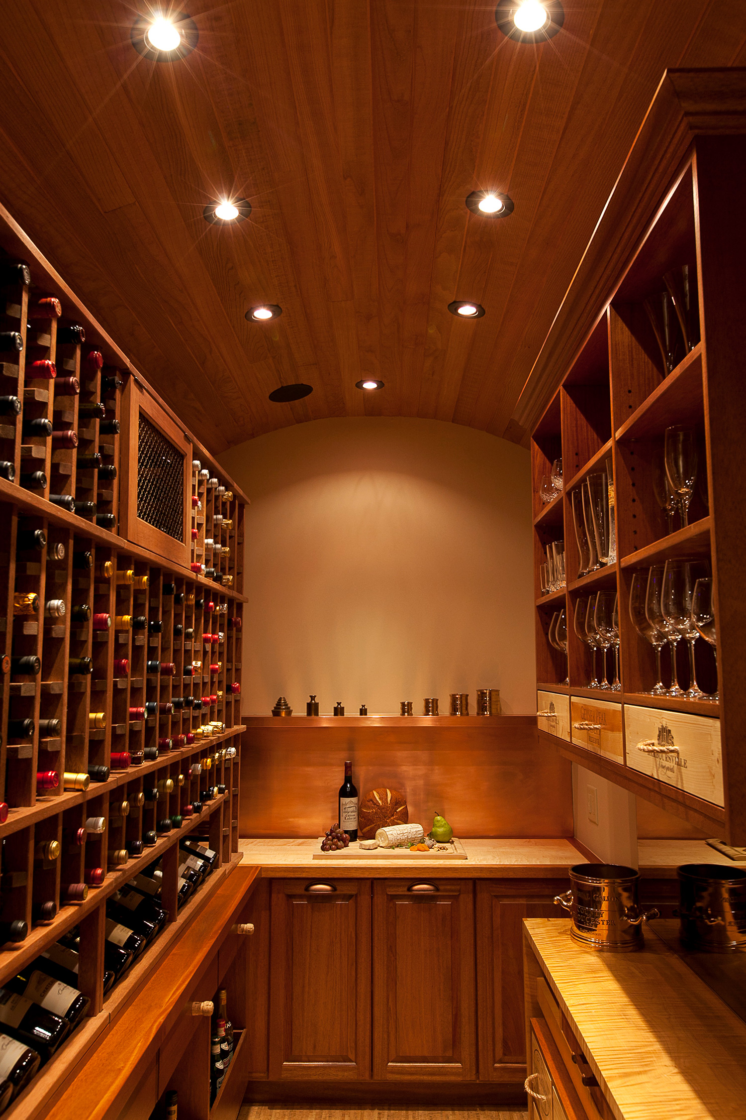 custom wine room with barrel ceiling